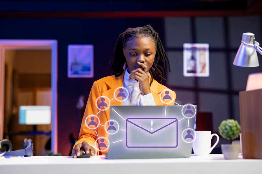 A woman at a desk sends lead nurturing emails following an expo