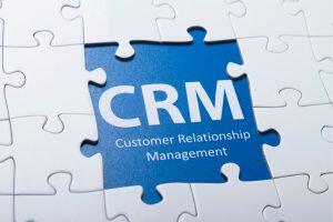 Puzzle piece labeled CRM representing customer relationship management integration