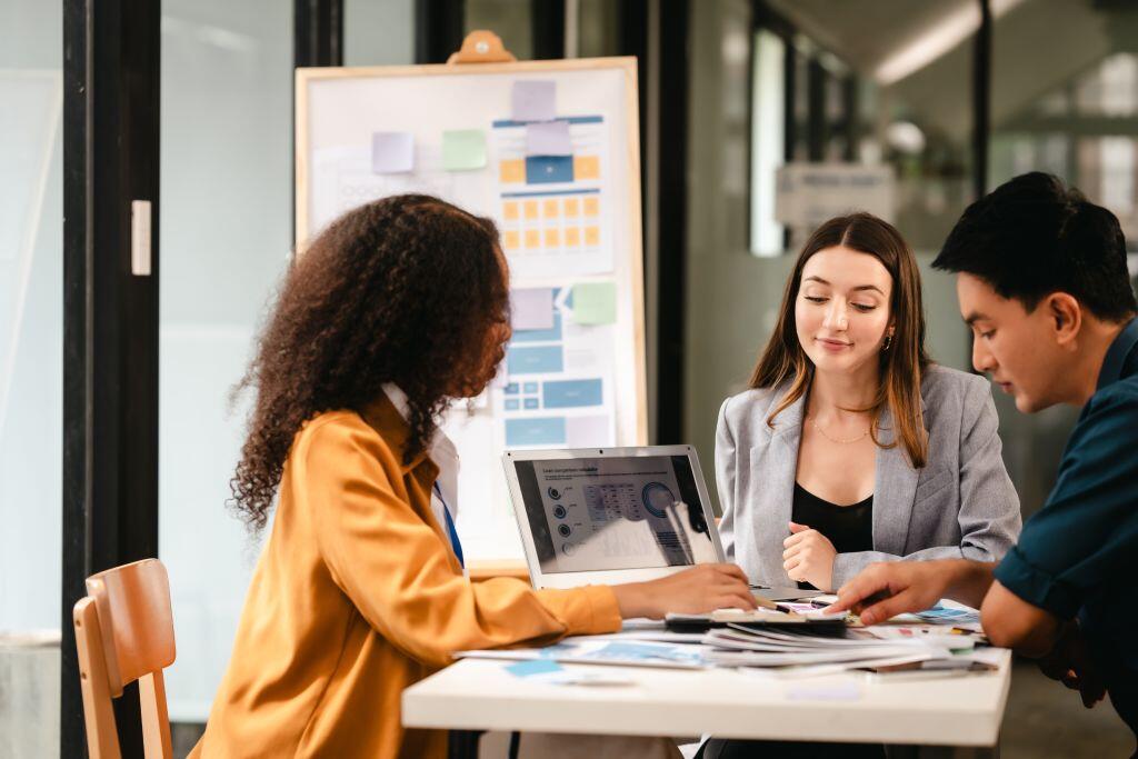 An SMB team meets to develop a strong brand strategy for their business