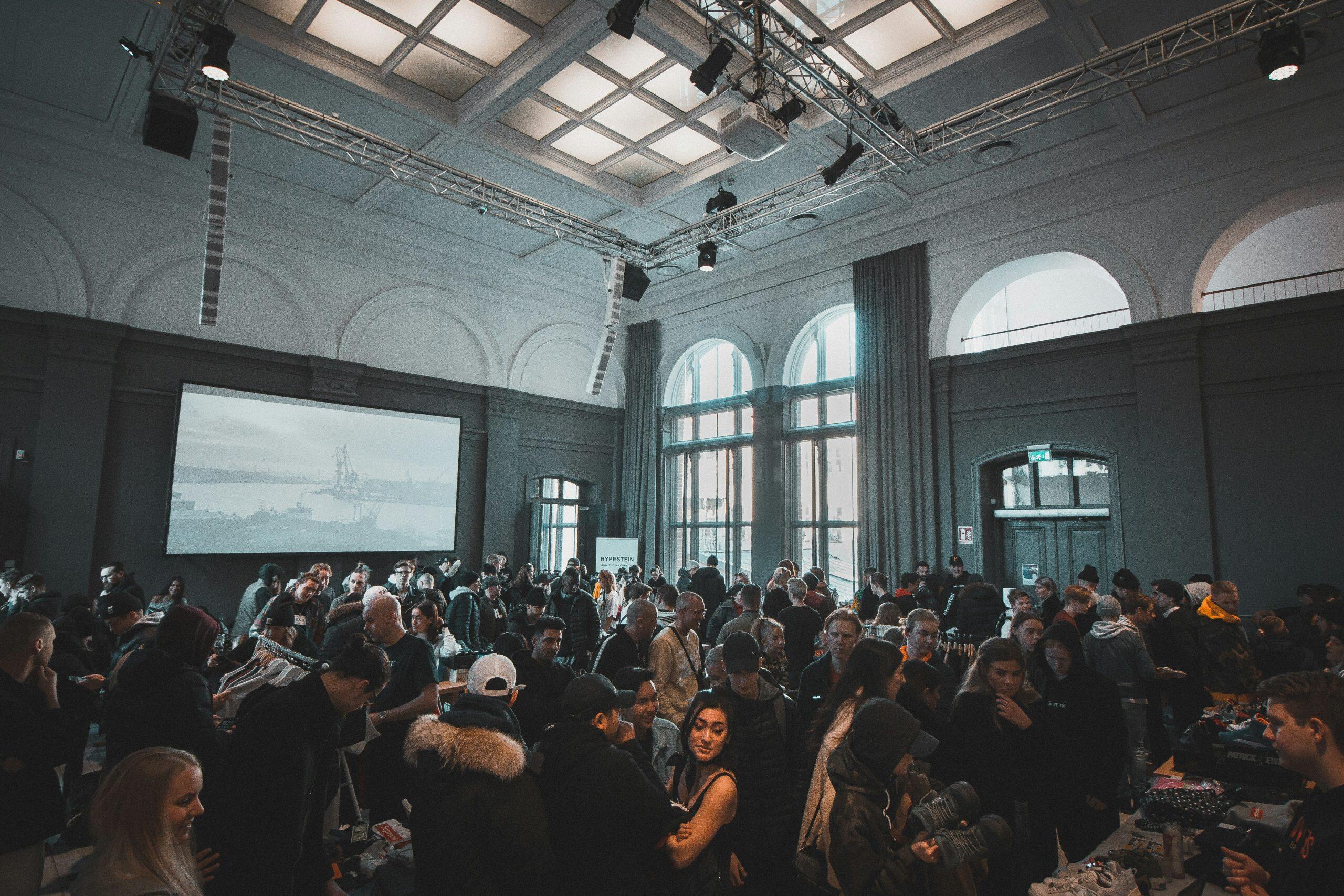 a large group of people in a room similar to networking events in NYC