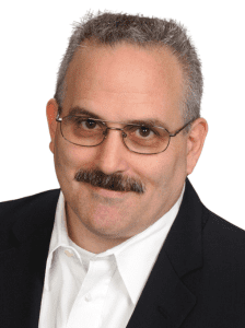 Headshot of Dennis Bell, speaker at the Small Business Expo for small business professionals.