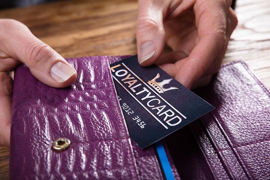 Close up on a wallet with a customer loyalty card inside